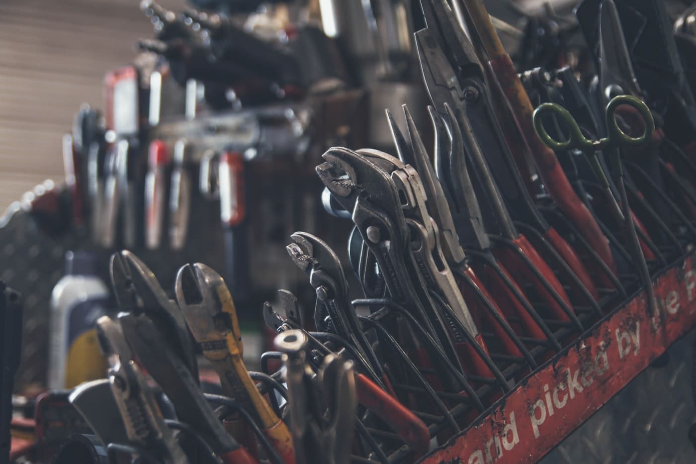 Technician pliers and hand tools ready for a repair job