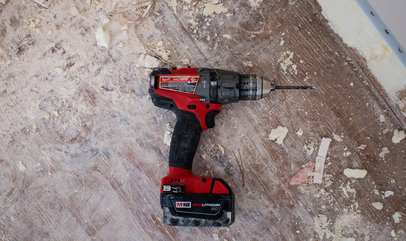Hands working with tools during a repair